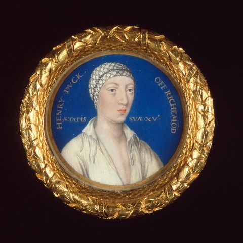 Watercolour. Shown from the shoulders up, a pale-skinned man wearing a white cap tied under his chin looks off to our right. The cap is patterned with a black geometric design. He has wide-set eyes, a long nose, and pursed pink lips. His white chemise is open over his chest. The round portrait is in a frame of gilded leaves.