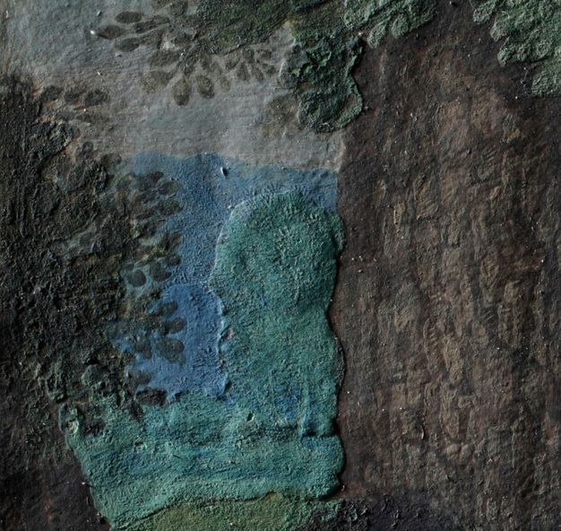 Painting. Detail view of a landscape in which the green area between blue and a brown trunk is noticeably raised and textured.