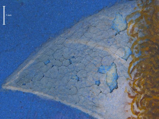 Painting. Detail view of a triangular, flaring collar. Cracks span the area, and some paint has fallen away to show the blue of the original background beneath.