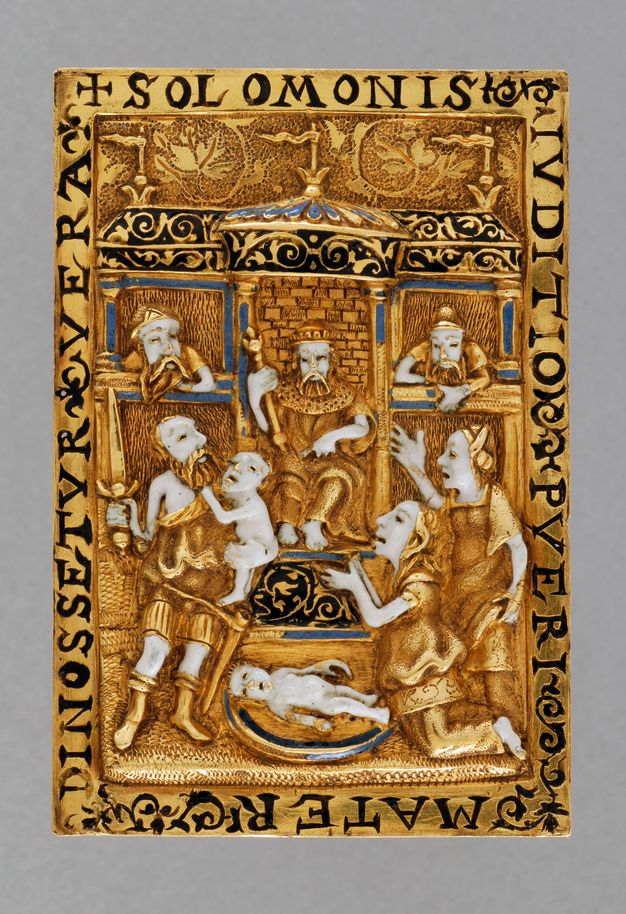 Book cover. In low, gold relief, a man sits on a throne in a temple-like structure. To our right, two women reach out, mouths open, towards a man holding a sword in one hand and a baby in the other. Another baby lies between the man and women. The skin of all the figures is white enamel, and a few architectural details are picked out in black or blue enamel.